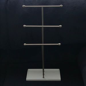 Silver and white necklace holder